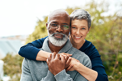 Buy stock photo Portrait, hug and senior couple with love, interracial and marriage with happiness, bonding and romance. Face, partners outside or mature woman with elderly black man, embrace and romantic with smile