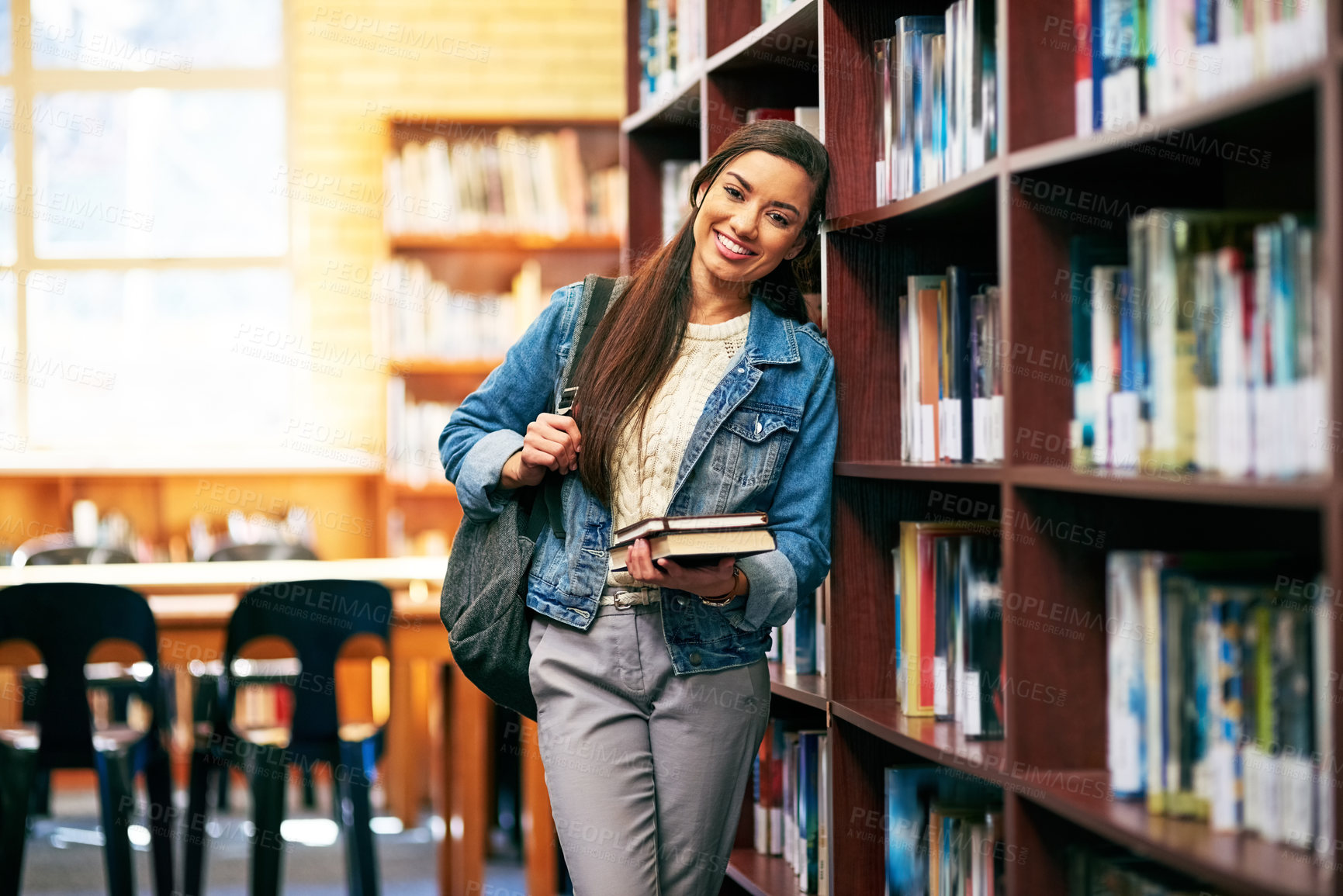 Buy stock photo Woman, portrait and learner in library with book, happy and academy literature or university thesis on campus. Education, knowledge and college information for scholarship, assignment and bookshelf
