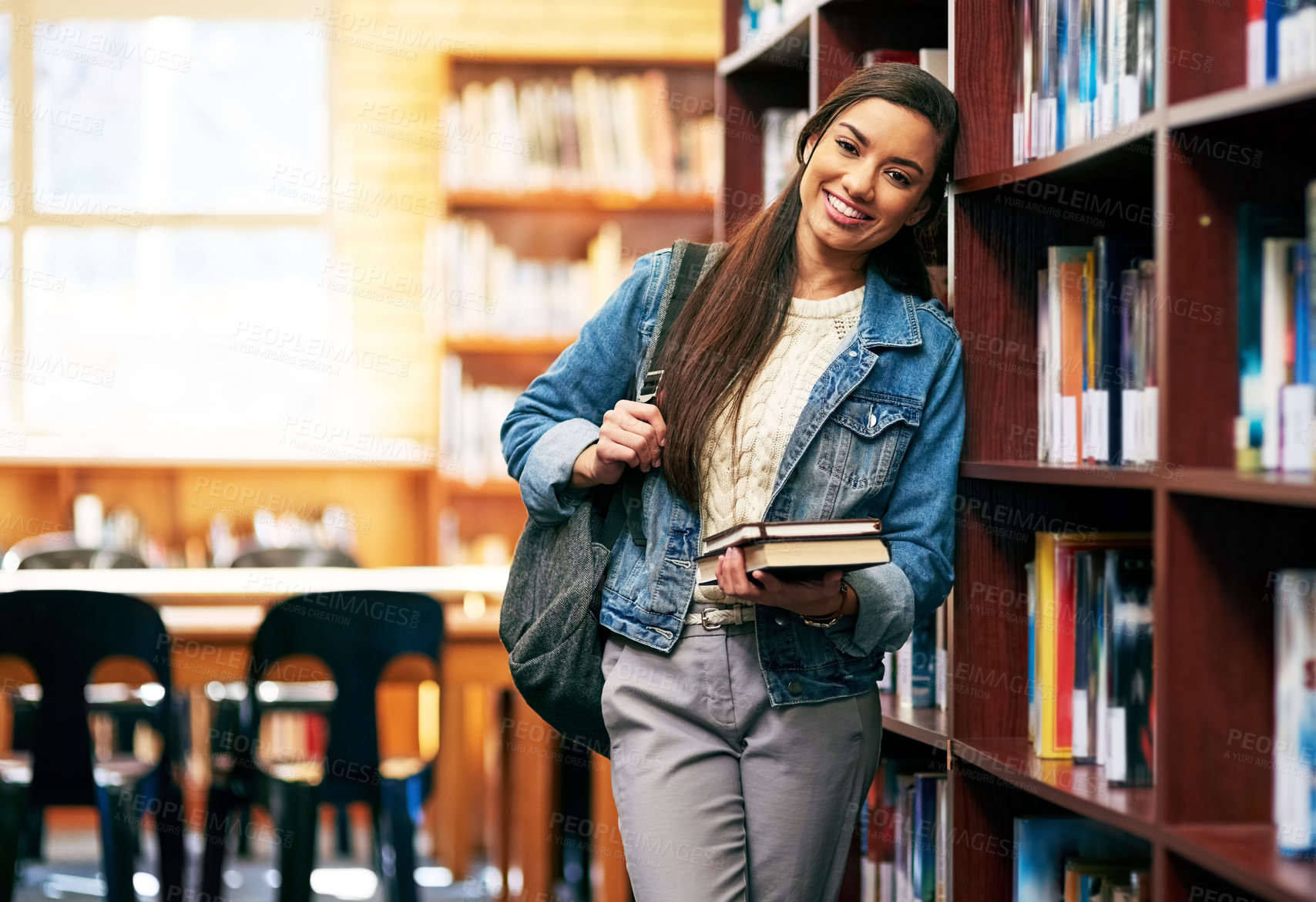 Buy stock photo Woman, portrait and learner in library with books, happy and academy literature or university thesis on campus. Education, knowledge and college information for scholarship, assignment and bookshelf
