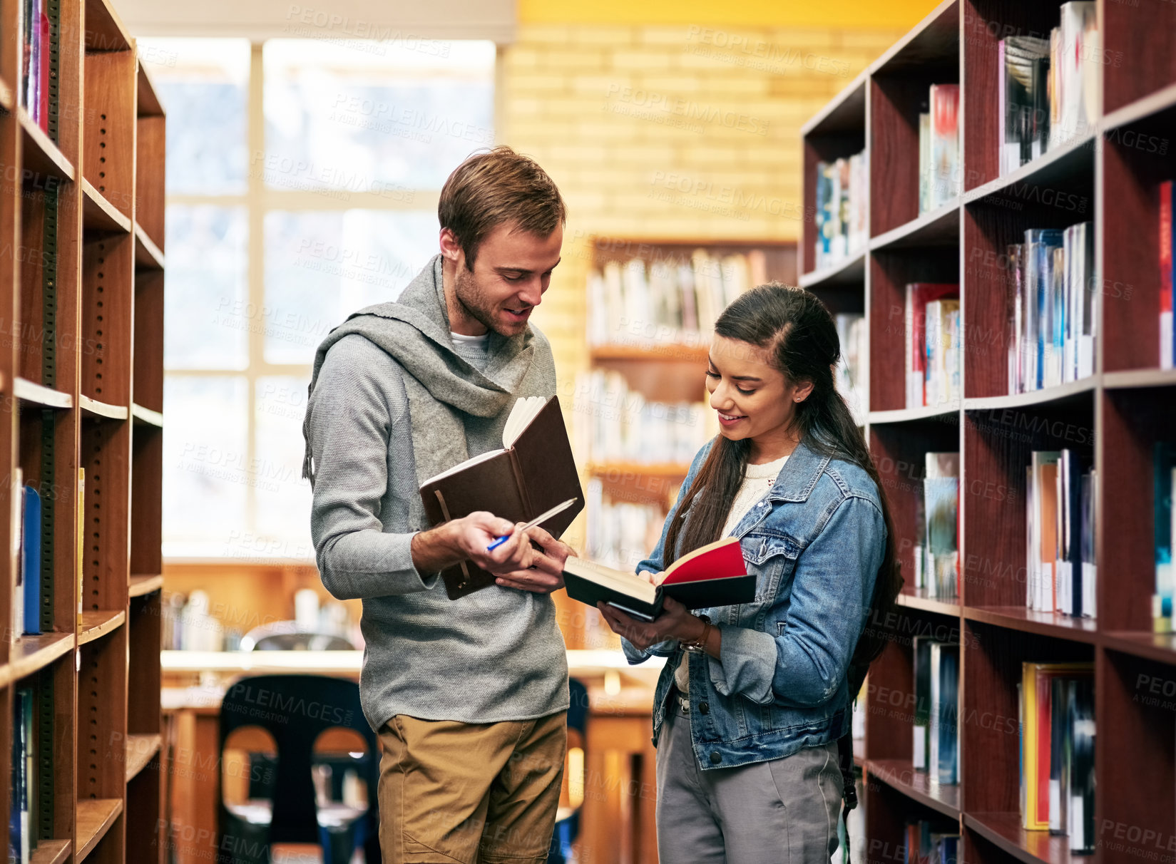 Buy stock photo People, students and library conversation with books, happy and campus for learning or university education. Discussion, academic scholarship and collaboration, exam preparation and college thesis
