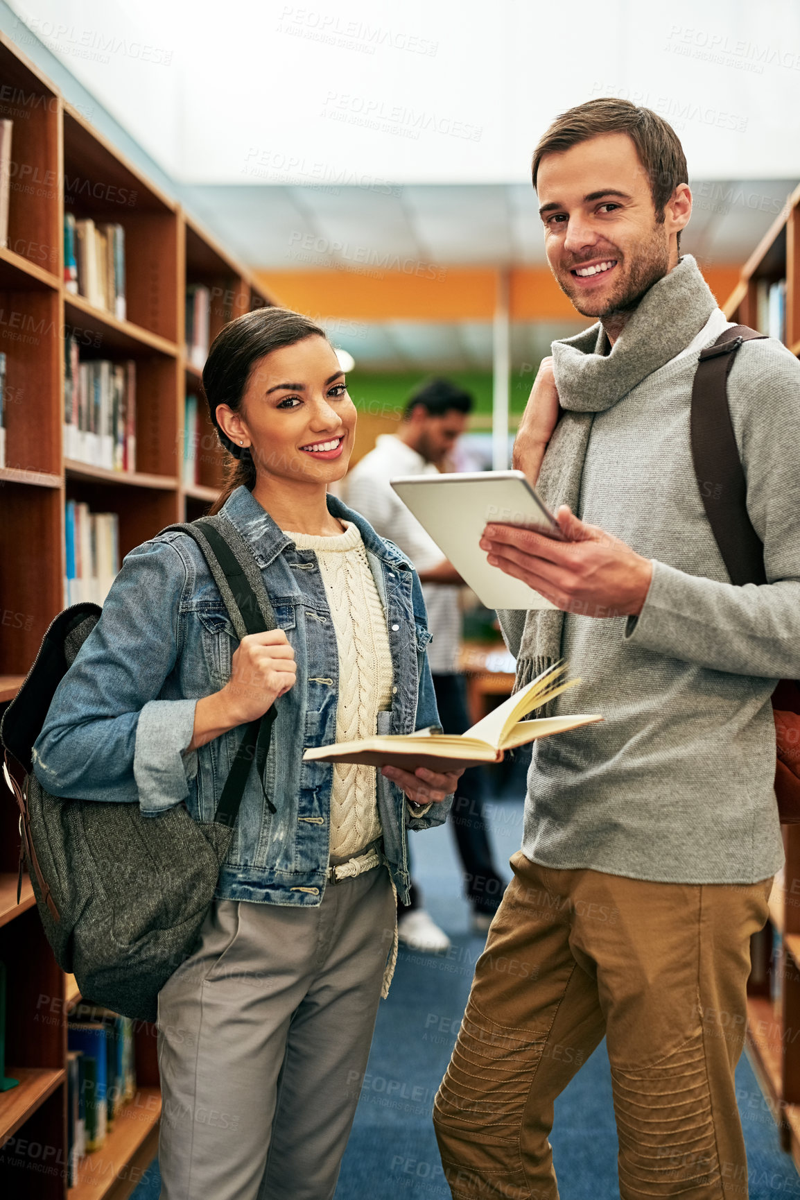 Buy stock photo Portrait of two university students working together in the library at campus