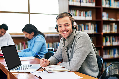 Buy stock photo Portrait of a university student working in the library at campus