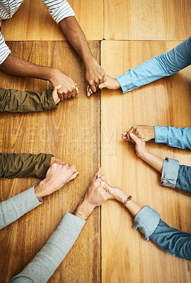 Buy stock photo Hands holding, support and people planning together for prayer circle, love and care in a team building table. Above, community and group teamwork by employees with hope, collaboration and help