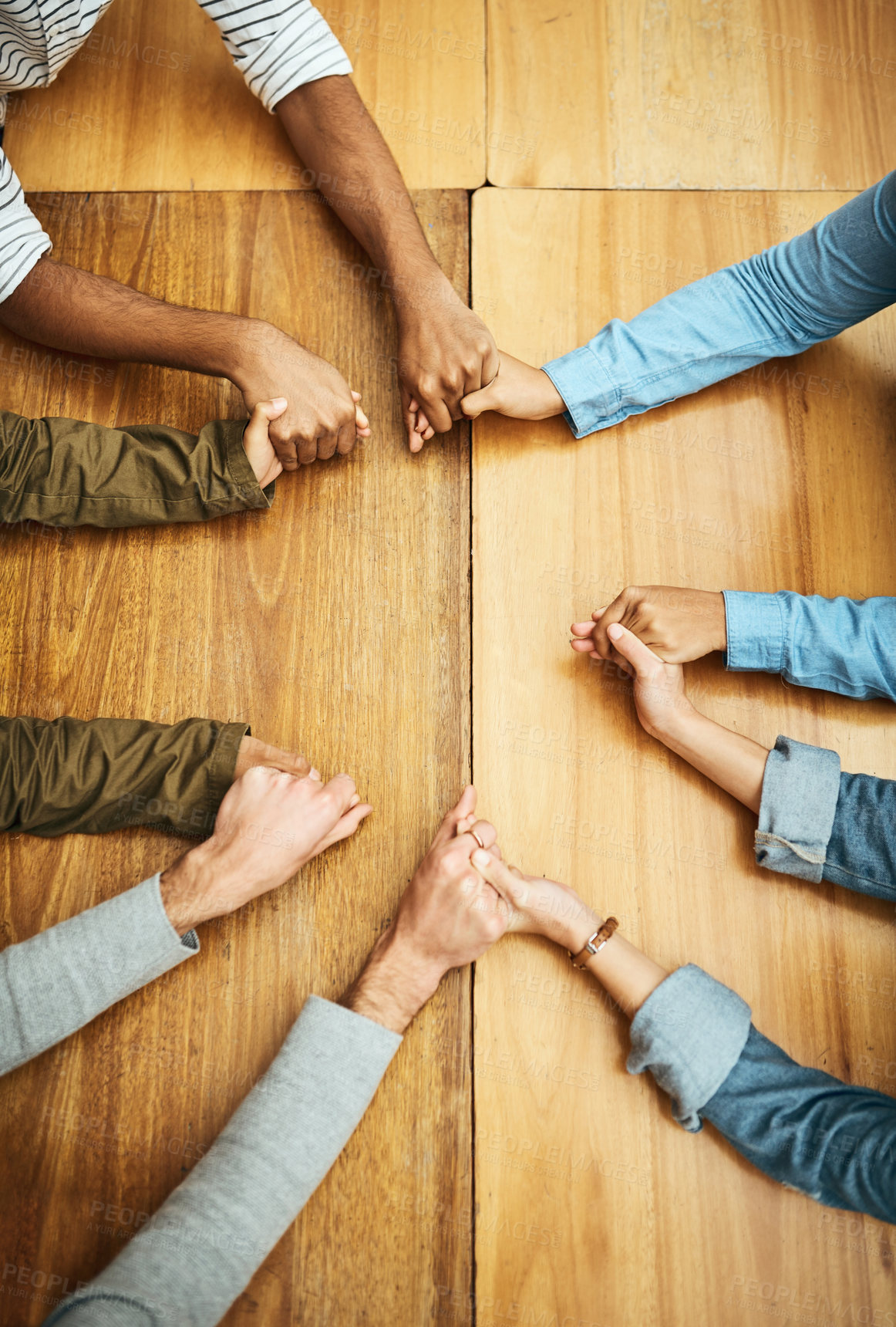 Buy stock photo Hands holding, support and people planning together for prayer circle, love and care in a team building table. Above, community and group teamwork by employees with hope, collaboration and help