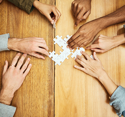 Buy stock photo Puzzle, building and hands of business people for collaboration, teamwork and working together. Meeting, diversity and workers with jigsaw for problem solving, challenge and cooperation in office