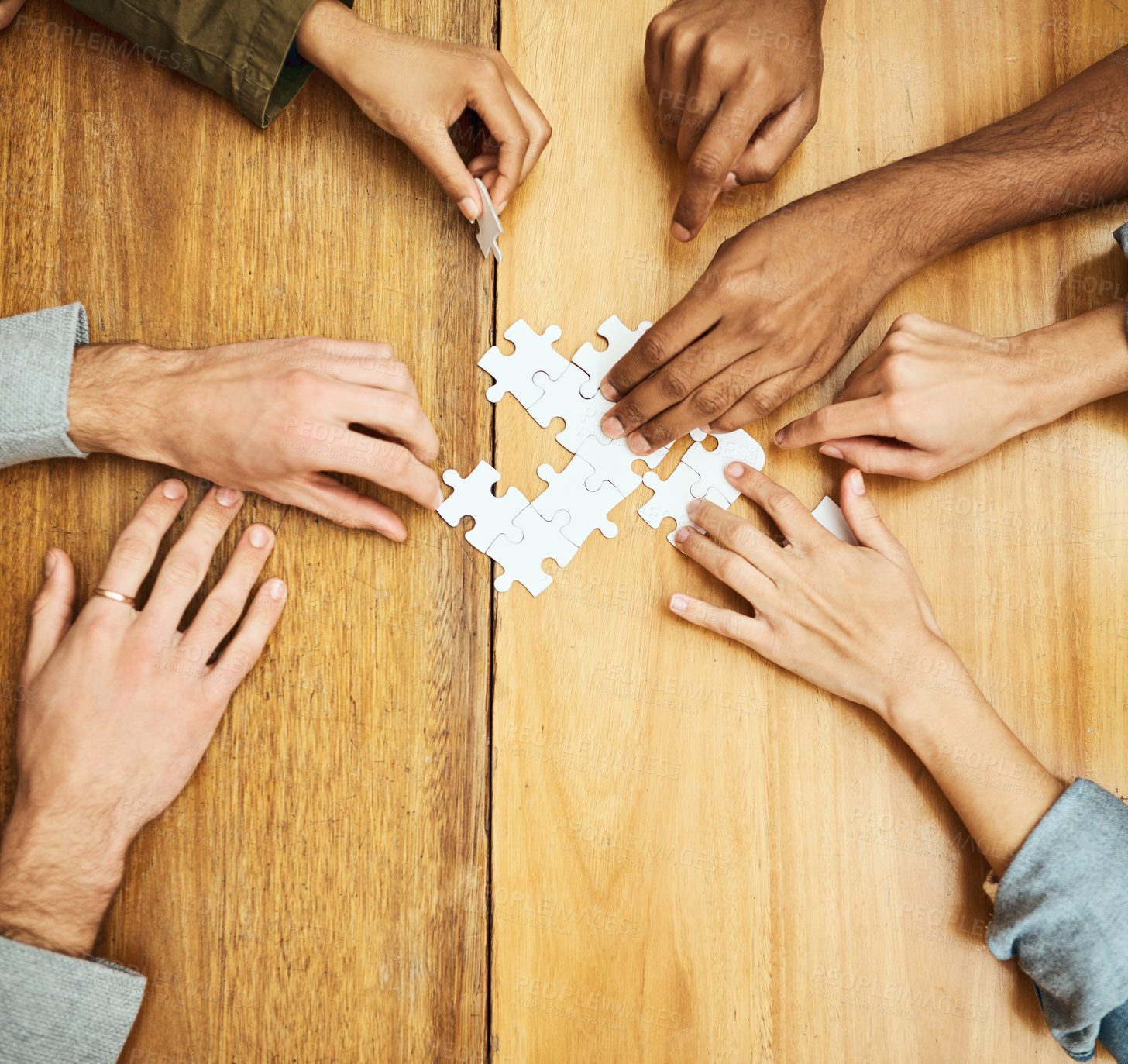 Buy stock photo Puzzle, building and hands of business people for collaboration, teamwork and working together. Meeting, diversity and workers with jigsaw for problem solving, challenge and cooperation in office