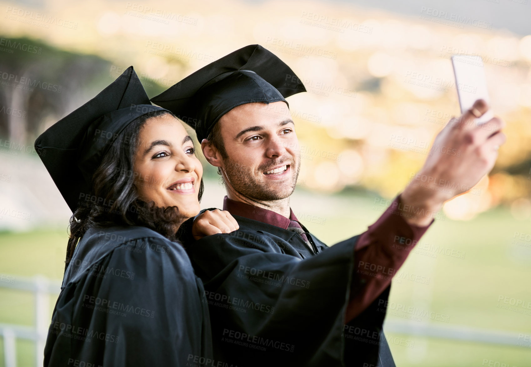 Buy stock photo Selfie, students and happy at graduation for diploma, achievement or education on campus. People, academy and smile for photography for social media, memories and excited for progress and celebration