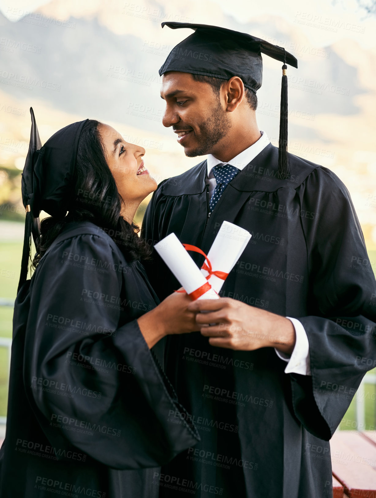 Buy stock photo Smile, graduate students and couple with certificate for goal achievement, success or education milestone. Happy, man and woman at graduation with diploma scroll outdoor for learning award at college