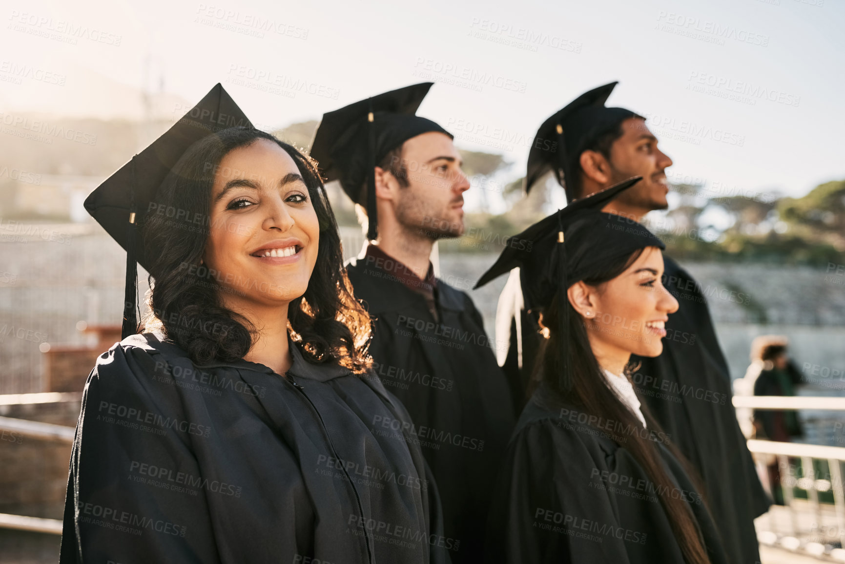 Buy stock photo Happy woman, students and graduation with class for qualification, degree or ceremony at university. Young, female person and group of graduates with smile for milestone, celebration or future dream