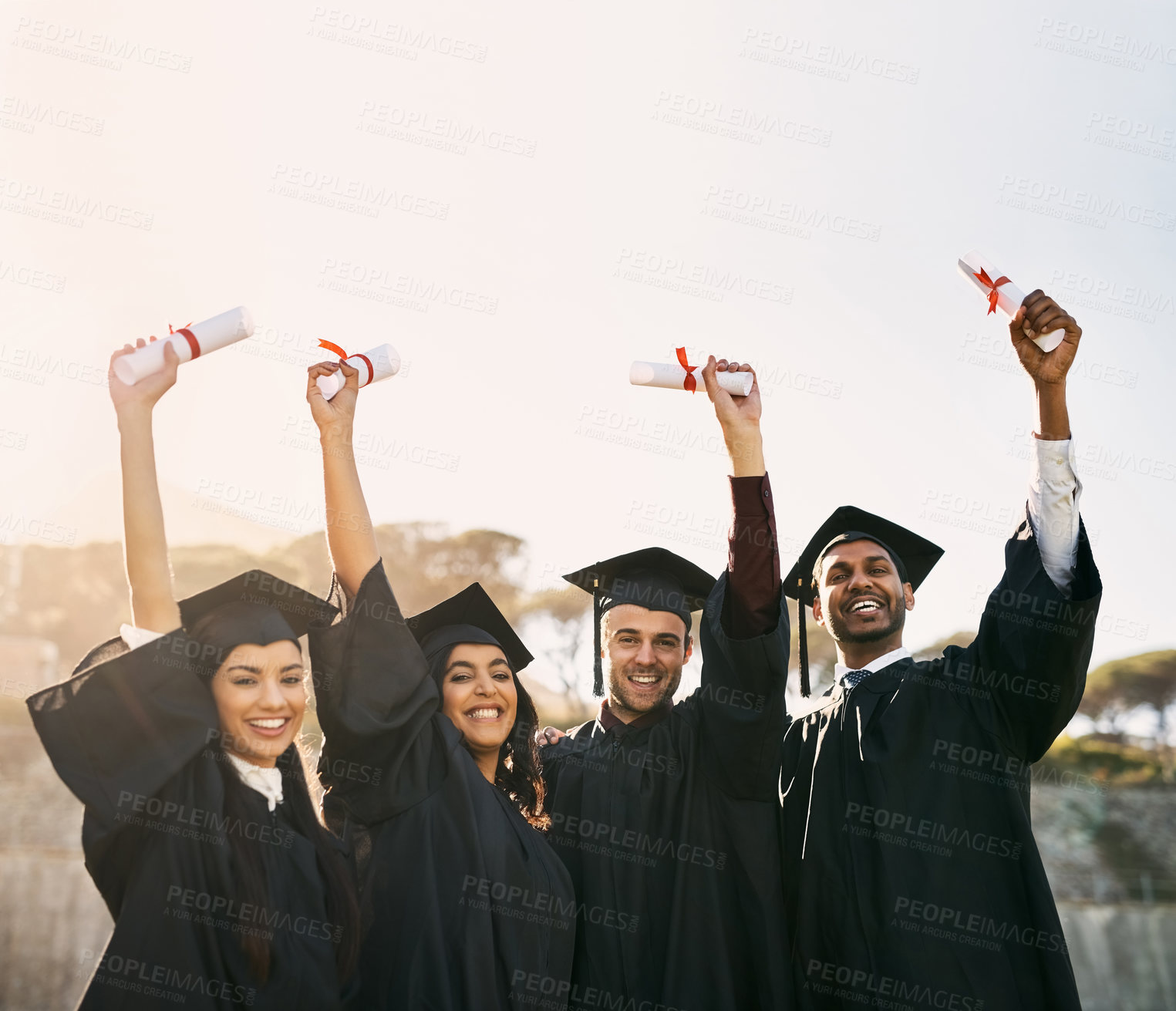 Buy stock photo Friends, graduation and smile with hands up on campus for celebration and success. People, college and university students with happiness on portrait for qualification, certificate and education
