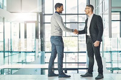 Buy stock photo Handshake, teamwork and working together with corporate business men and colleagues at work as a team. Making a deal during a meeting, greeting and coming to an agreement in a modern office