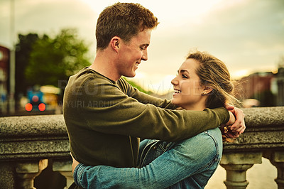 Buy stock photo Happy couple, hug and relax with love in city for embrace, support or outdoor travel together. Young man, woman or lovers with smile, comfort or affection on romantic holiday or trip in an urban town