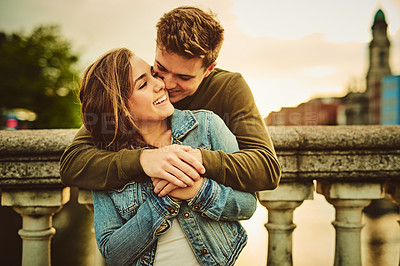 Buy stock photo Cropped shot of a young couple out on a date in the city