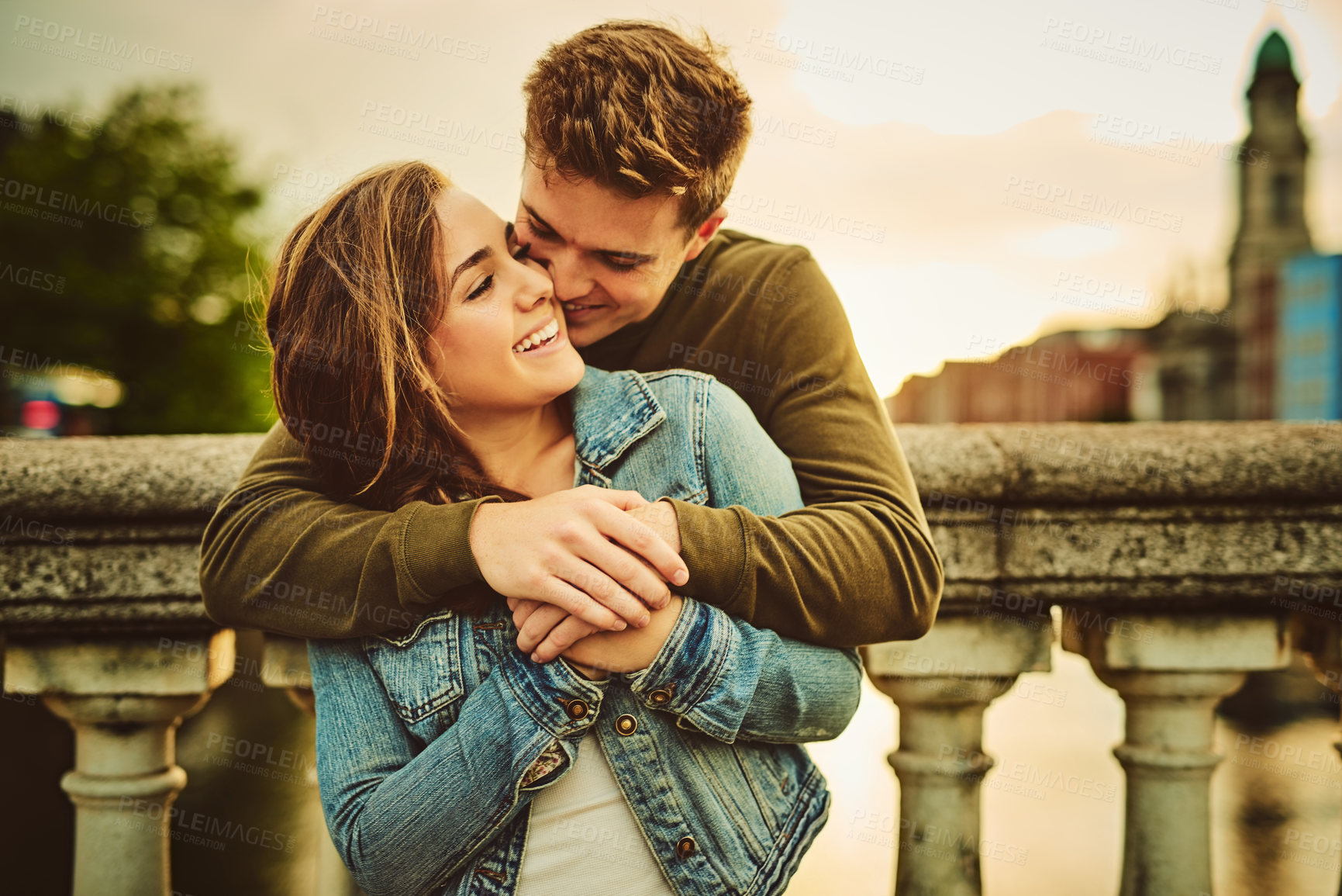 Buy stock photo Cropped shot of a young couple out on a date in the city