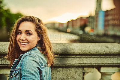 Buy stock photo Happy woman, portrait and travel to city on bridge, holiday and trip to Amsterdam on weekend vacation. Female person, location and urban town for outdoor freedom, tourist and walking in Netherlands