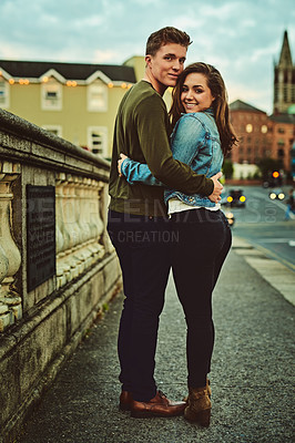 Buy stock photo Cropped shot of a young couple out on a date in the city