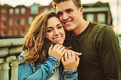 Buy stock photo Happy couple, portrait and love with hug for embrace, date or care on outdoor holiday or weekend in city. Young man, woman or lovers with smile for relationship, travel or trip in town or France