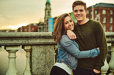 Buy stock photo Happy couple, portrait and support with hug for embrace, love or care on outdoor holiday or weekend in city. Young man, woman or lovers with smile for quality time, travel or trip to town in England