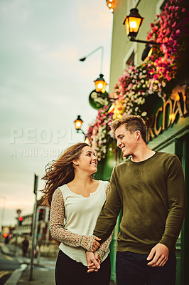 Buy stock photo Cropped shot of a loving young couple out on a date