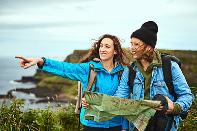 Buy stock photo Shot of a young couple travelling outdoors