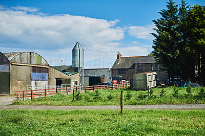 Buy stock photo Blue sky, countryside and buildings with landscape, farm and environment for agriculture. Empty, factory and barn with industry, organic and small business with sustainability and eco friendly