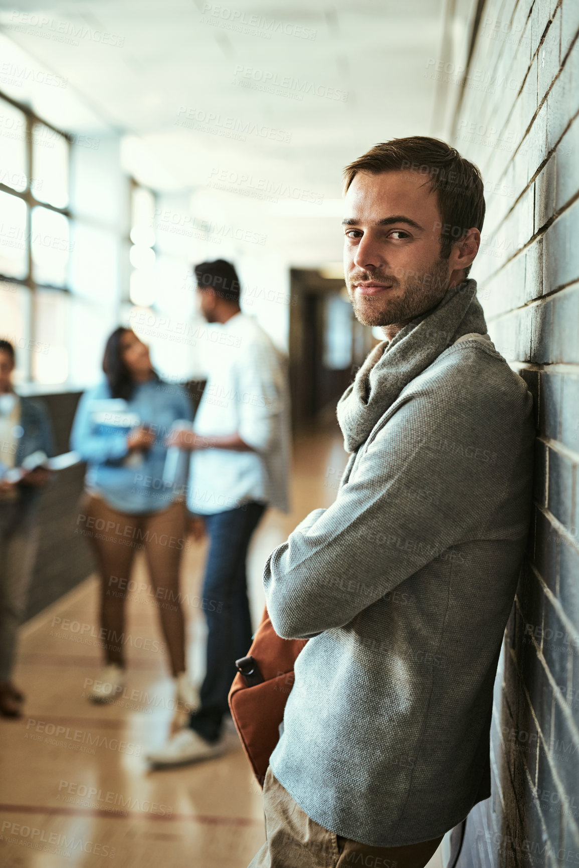 Buy stock photo Student, education and portrait for study, university and project for class, learning and grades. Male person, confidence and pride with arms crossed, backpack and smile in corridor for lesson in USA