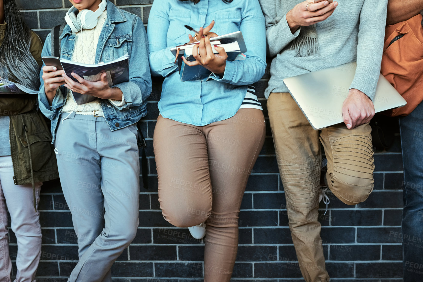 Buy stock photo Phone, hands of students and typing at wall for contact, registration and scroll in social media. People, tech and app in hallway for online mobile game, instant messaging and check class schedule