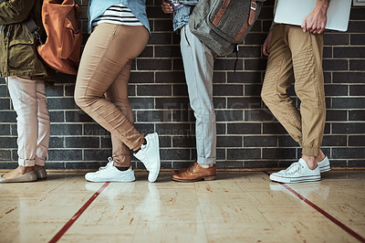 Buy stock photo Cropped shot of a
 group of unrecognizable university students standing in a campus corridor