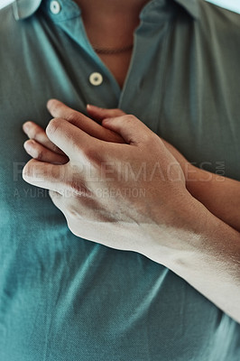 Buy stock photo Cropped shot of a man placing his girlfriend's hand on his heart