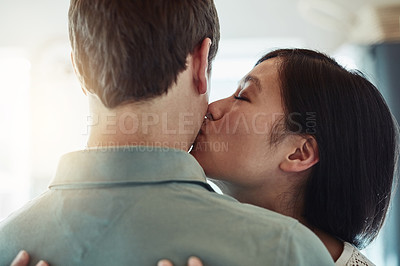Buy stock photo Cropped shot of a loving young couple relaxing at home