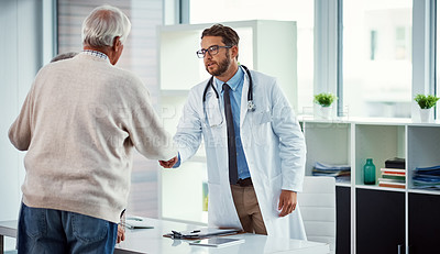 Buy stock photo Shot of a doctor meeting with a senior man in a clinic