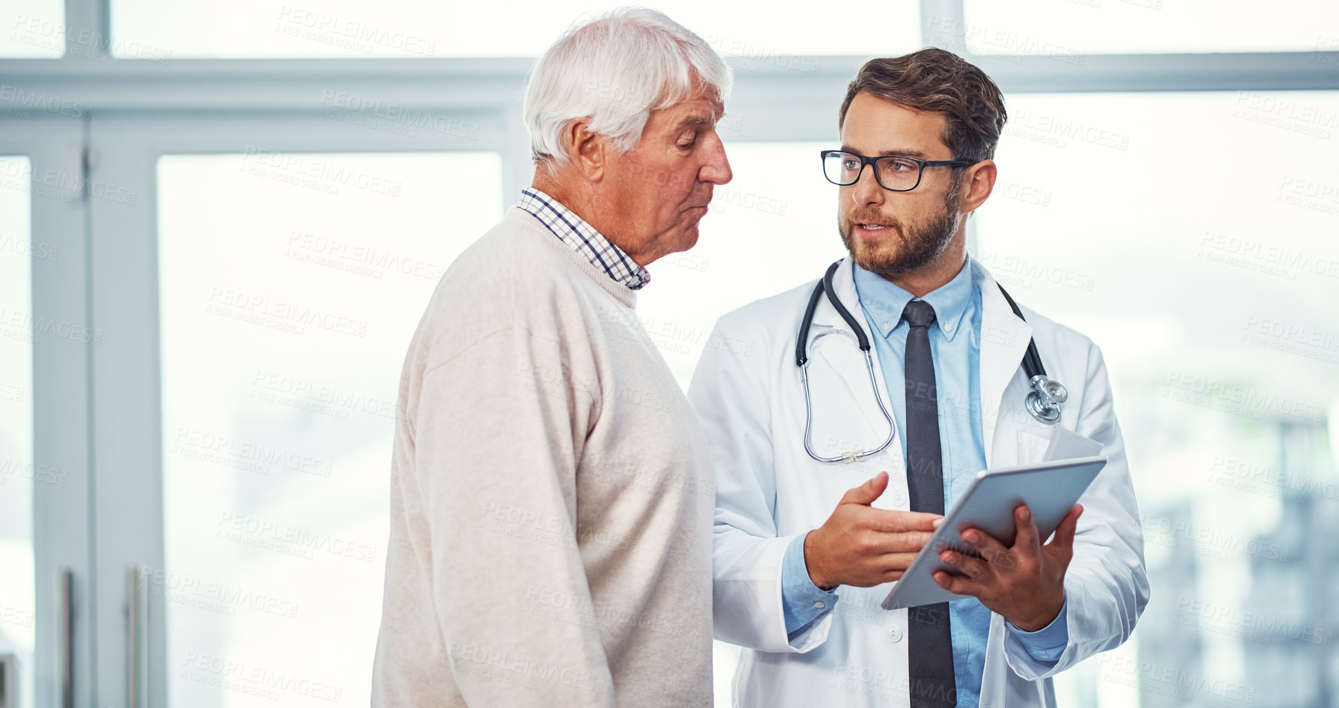 Buy stock photo Doctor, old man and discussion in office with tablet, consultation and test results for medical help. Elderly person, healthcare worker and talking in clinic with tech, patient diagnosis and advice.