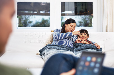 Buy stock photo Shot of a family bonding together at home