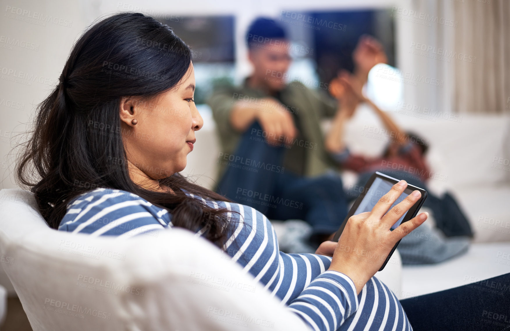 Buy stock photo Tablet, pregnancy and woman in home with online app, maternity research or reading blog. Technology, pregnant mother and person in living room for prenatal info, social media and relax with family