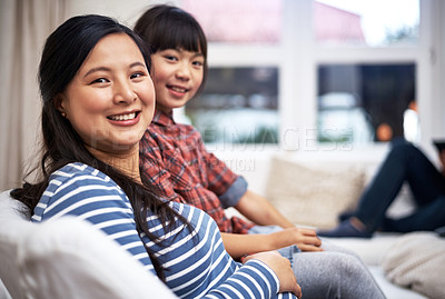 Buy stock photo Portrait of a mother and her little daughter bonding together at home
