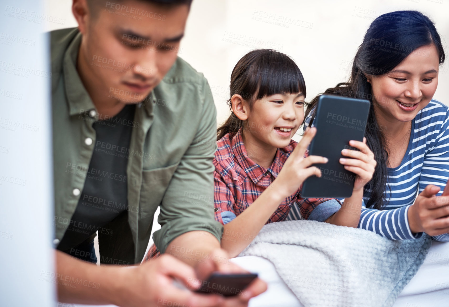 Buy stock photo Ignore, asian family and happy with tech on bed for online streaming, antisocial or web addiction. Parents, child or smile with tablet in home for social media browsing, internet dependence or gaming