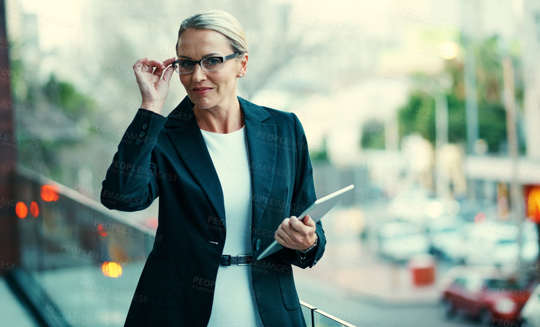 Buy stock photo Happy woman, tablet and glasses on balcony at office with notes, pride or project at insurance company. Mature person, broker and advisor in portrait, tech or app at risk management agency in Germany