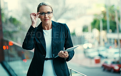 Buy stock photo Woman, tablet and glasses on balcony at office with smile, notes or checklist at insurance company. Mature person, broker and happy with tech, review or portrait at risk management agency in Germany