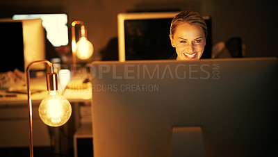 Buy stock photo Shot of a mature businesswoman working late at the office