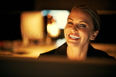 Buy stock photo Shot of a mature businesswoman working late at the office 