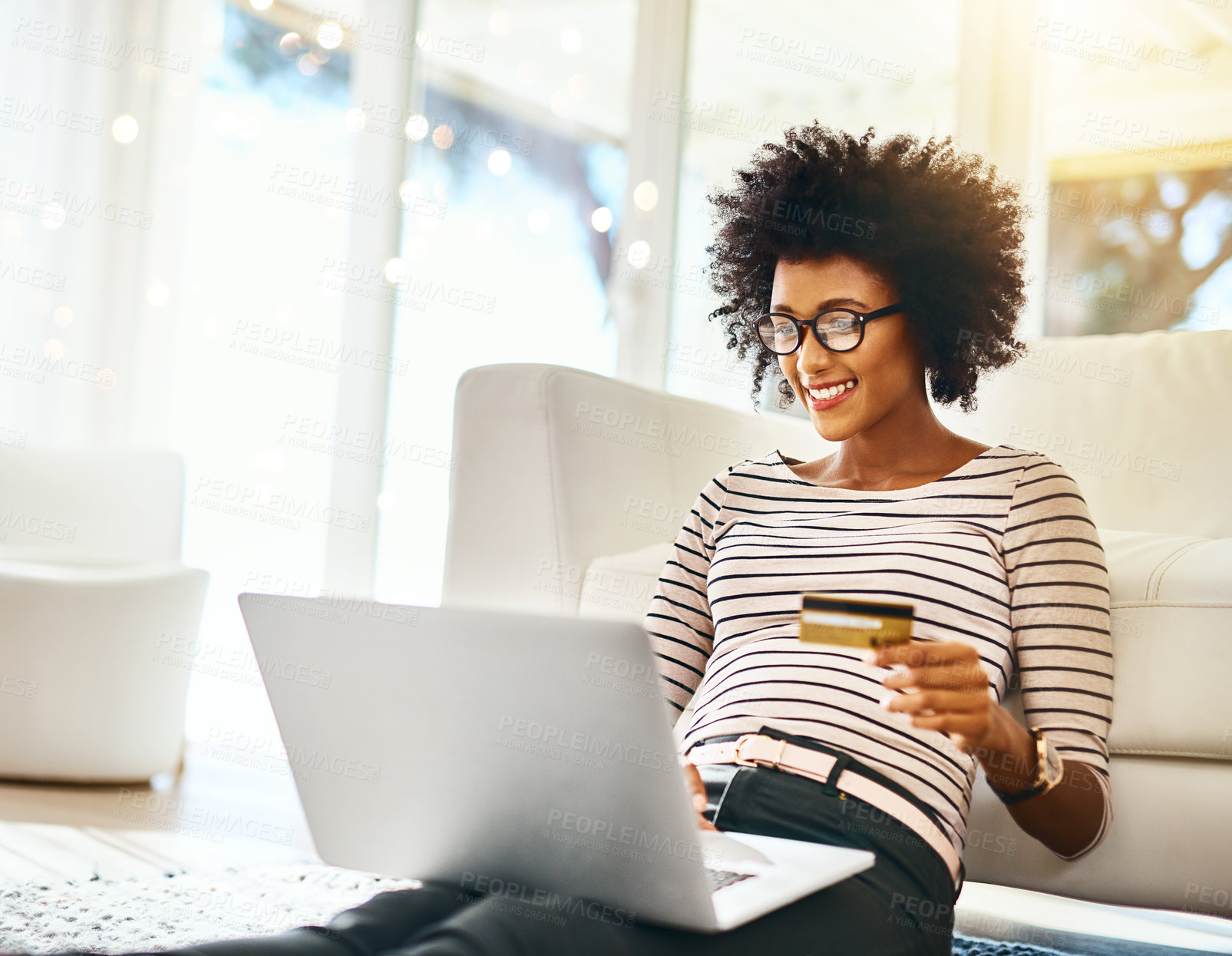 Buy stock photo Young woman, laptop and credit card in living room doing online shopping sitting on ground. Home, happiness and computer of African female person on a internet ecommerce app reading online deal