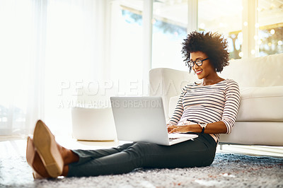 Buy stock photo Young woman, laptop and living room floor relax doing online shopping sitting on ground. Home, happiness and computer typing of African female person on a ecommerce app reading PC deal with smile