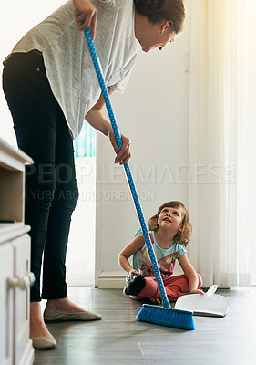 Buy stock photo Broom, sweeping and mom with girl in home for chores, teaching or learning hygiene routine. Housekeeping, mother and daughter cleaning floor together with support, care and child development in house