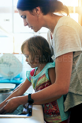 Buy stock photo Washing, dishes and mom with girl, help and teaching chores, learning hygiene and routine in home. Housekeeping, mother and daughter cleaning kitchen together in support, care and child development