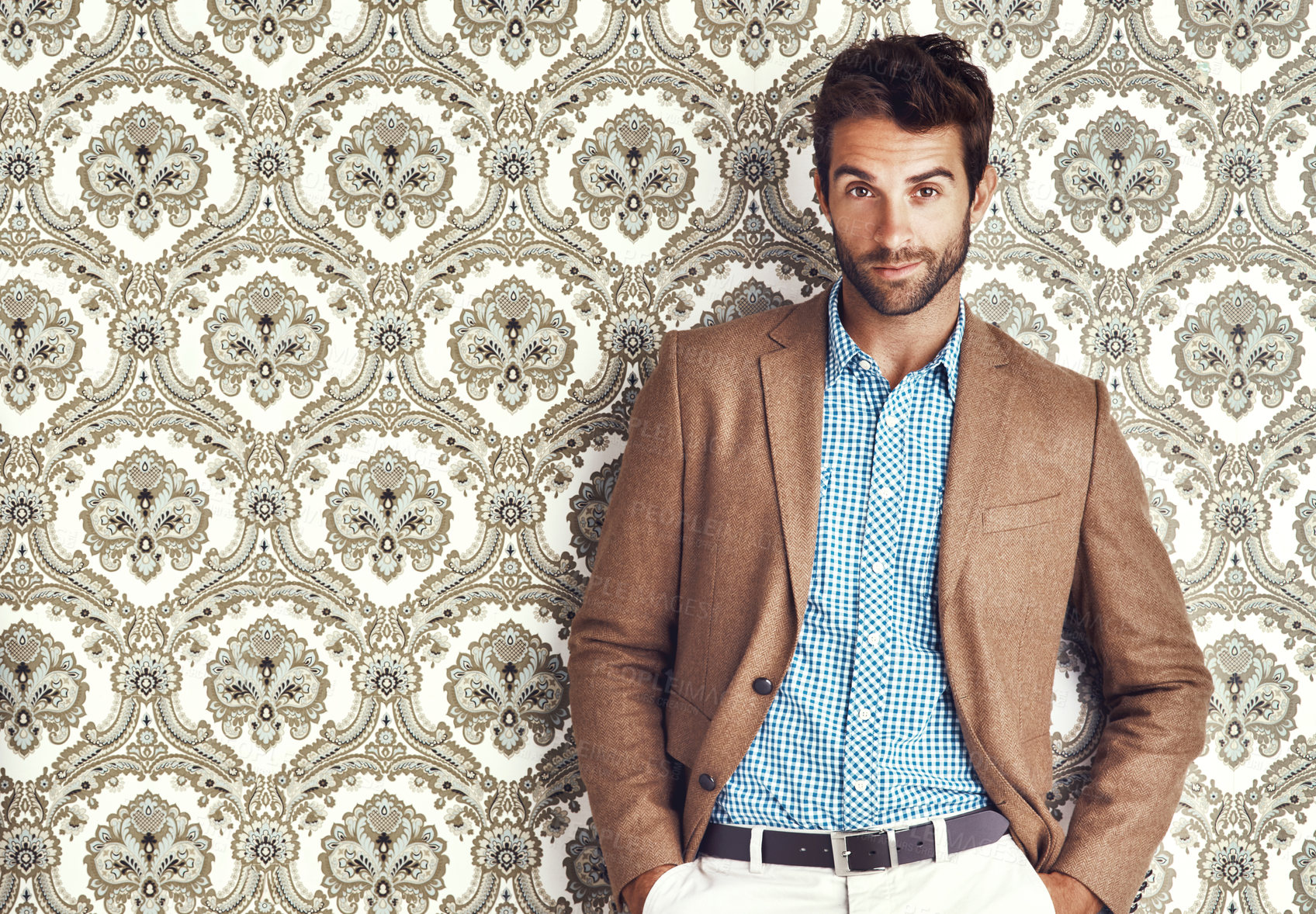 Buy stock photo Portrait, confidence and man in suit for fashion on a vintage wallpaper background isolated in studio. Face, style and male person in clothes, blazer and retro pattern of classy model in Switzerland