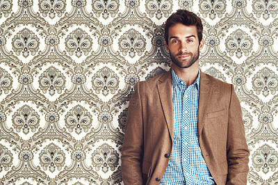 Buy stock photo Portrait, confidence and man in suit for fashion on a vintage wallpaper background isolated in studio. Face, style and male person in blazer, clothes and retro pattern of classy model in Australia