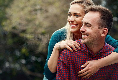 Buy stock photo Shot of an affectionate young couple spending quality time together outdoors