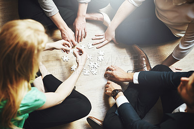Buy stock photo Puzzle, teamwork and group of people thinking, planning or solution, collaboration or problem solving and challenge. Team building games, project workflow and women, men or circle brainstorming above