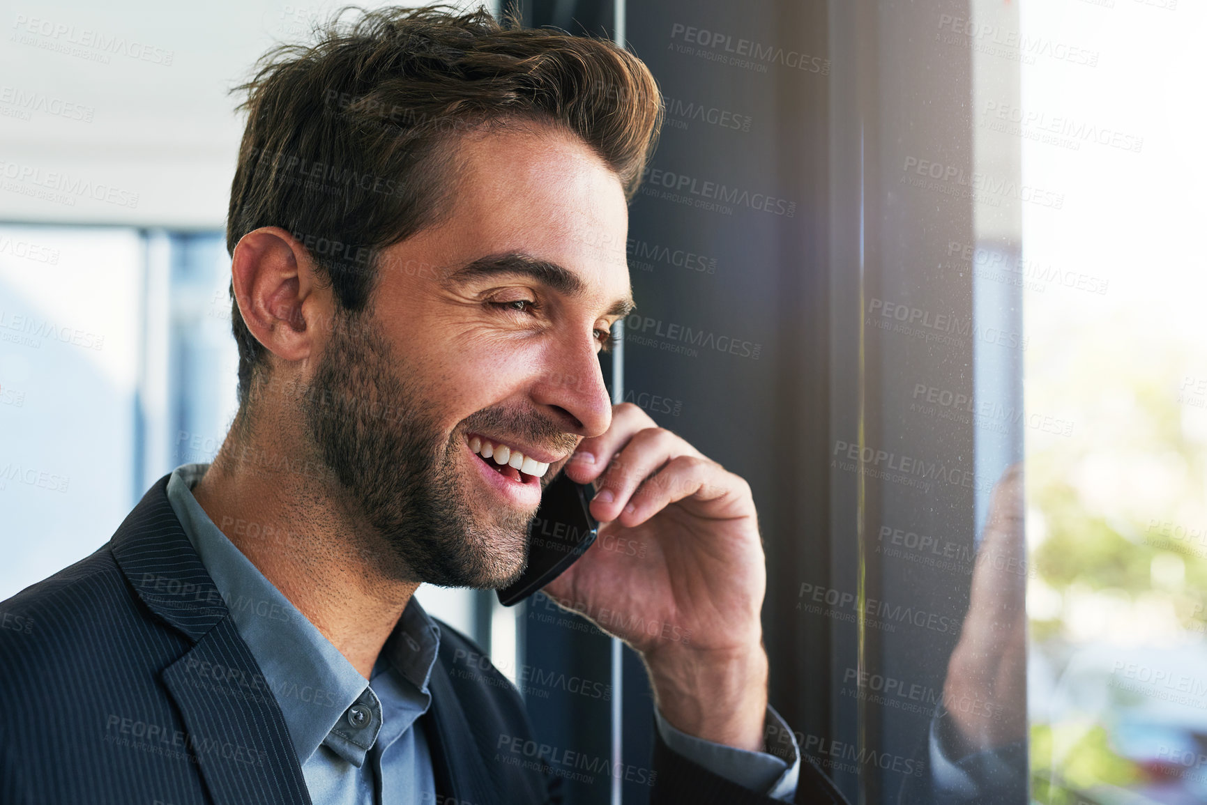 Buy stock photo Happy, businessman and thinking with phone call for conversation, communication or proposal by window at office. Man or employee with smile on mobile smartphone for business discussion at workplace