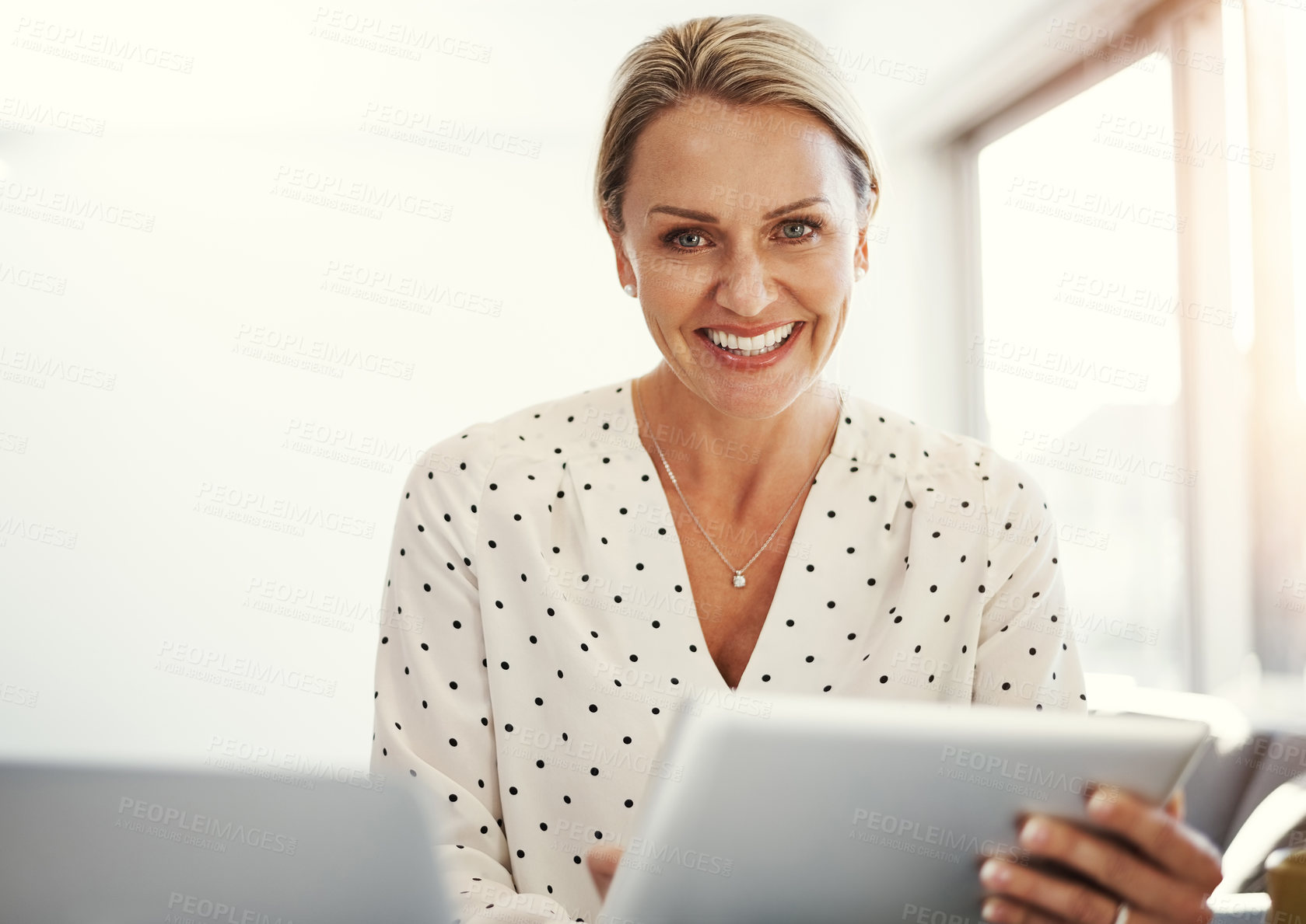 Buy stock photo Cropped shot of a mature businesswoman working from her home office